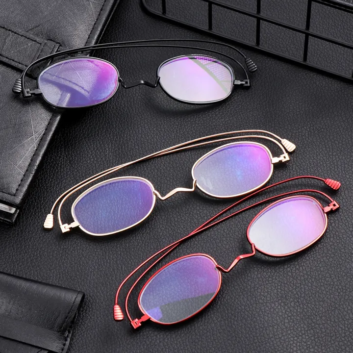 small reading glasses in metal case