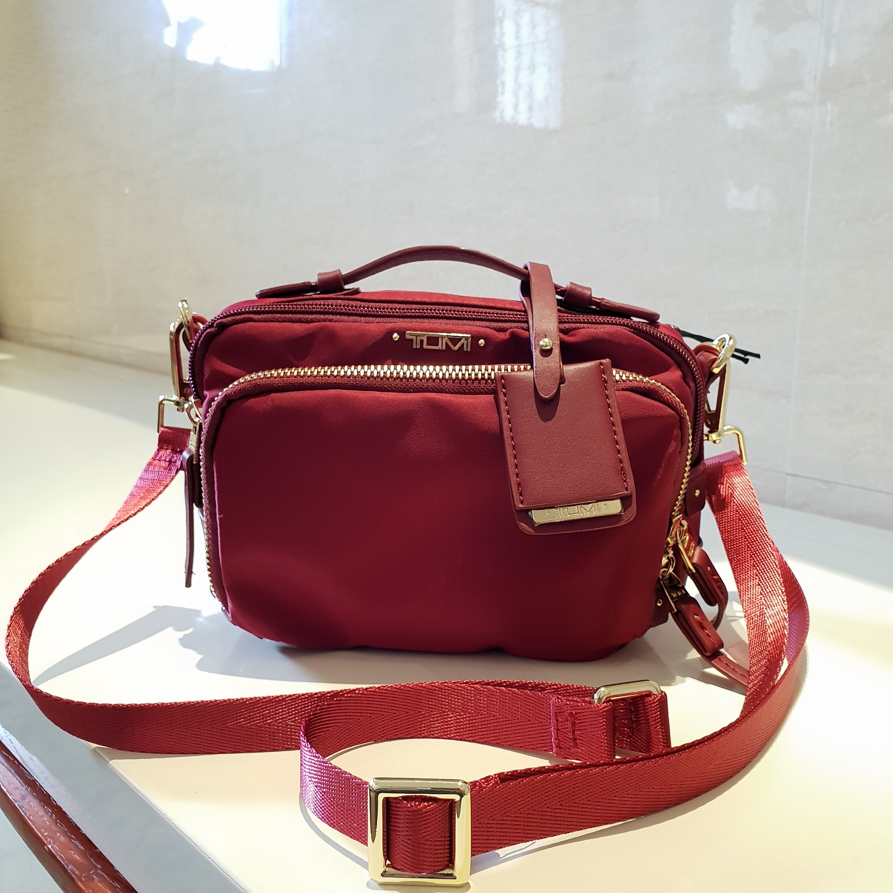 tumi sling bag for ladies