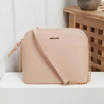 beige sling bag