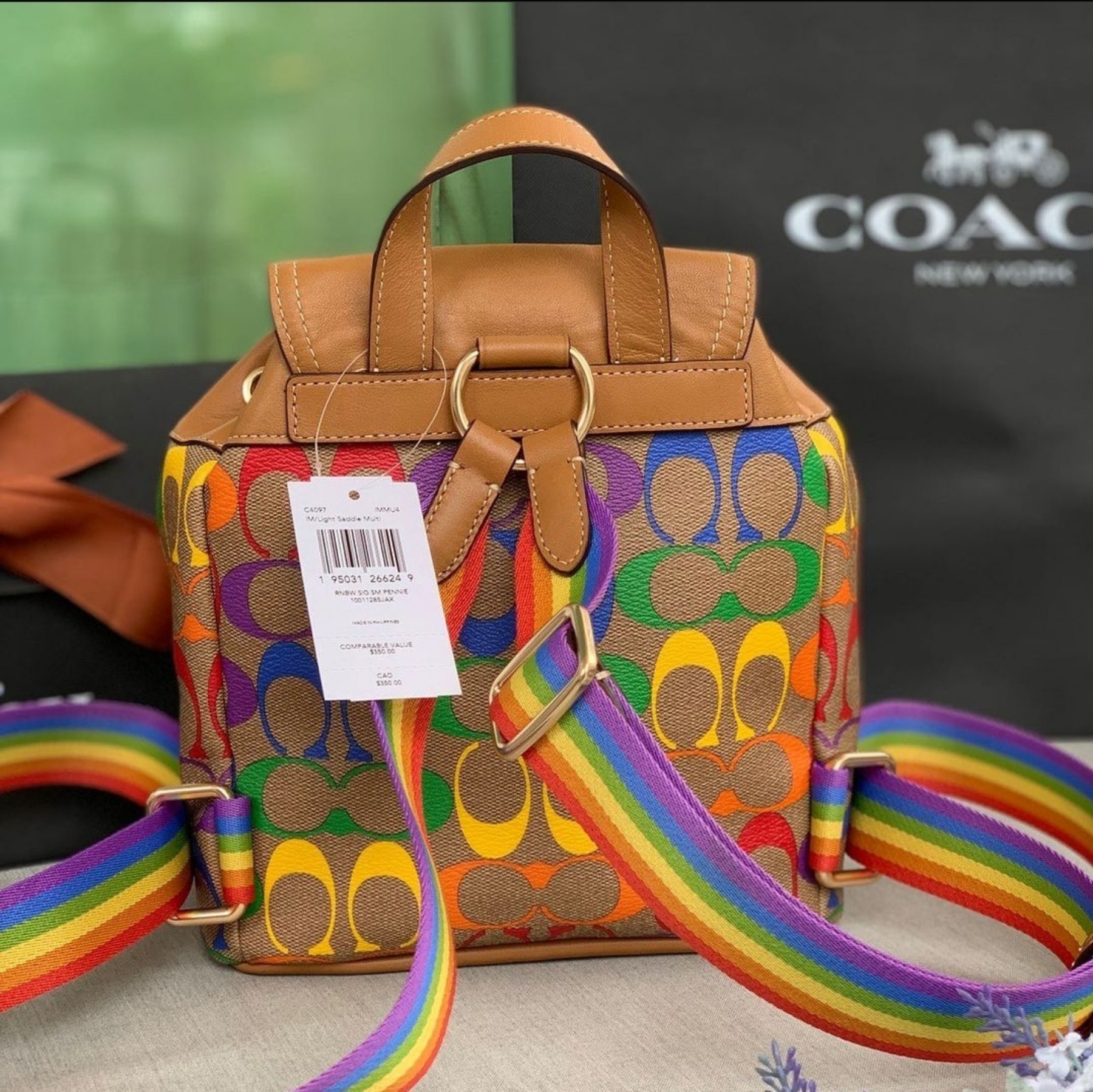 COACH Pennie Backpack 22 Rainbow Signature Canvas in Light Saddled