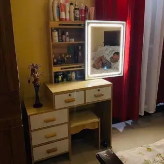 vanity with desk and lights