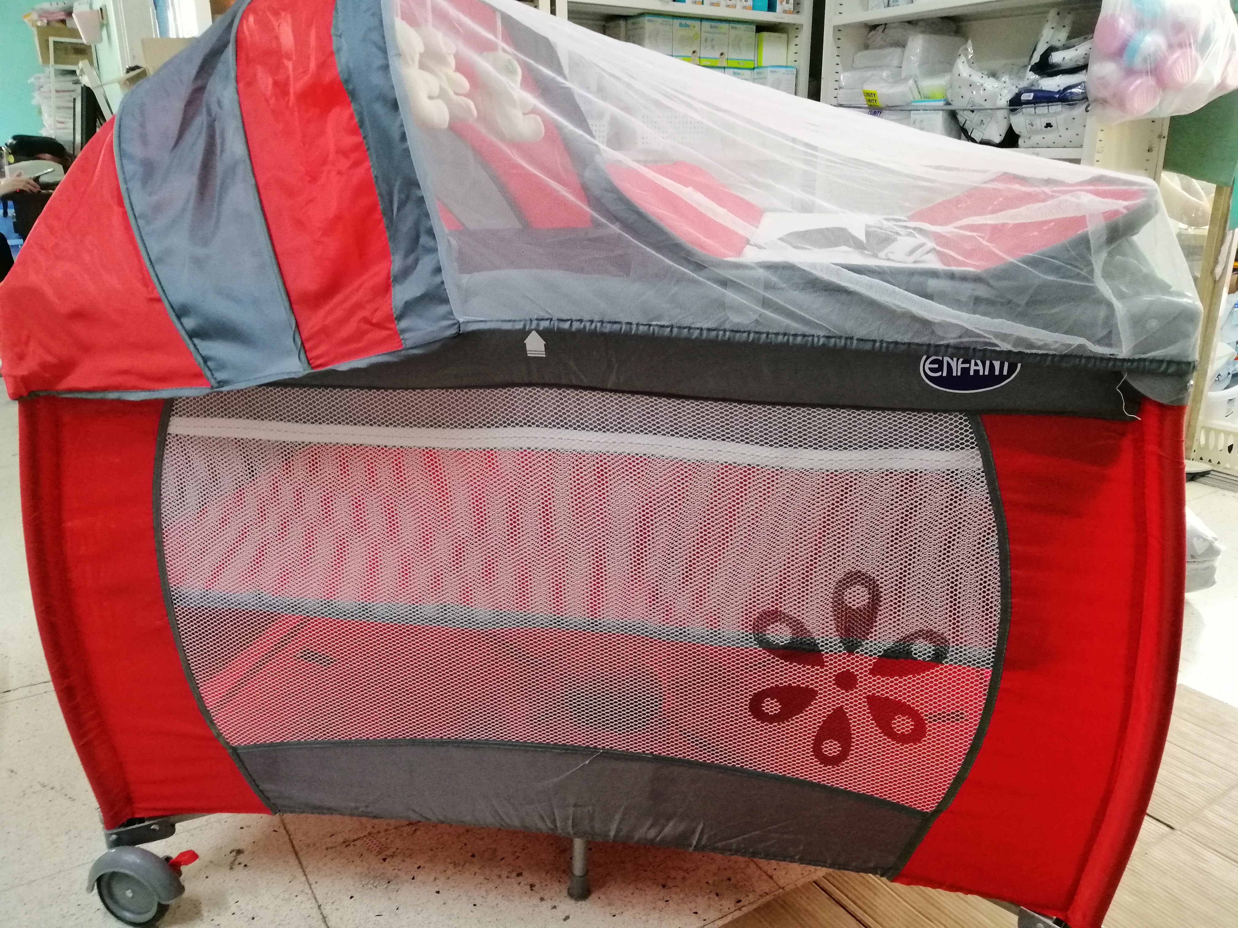 pink crib with changing table