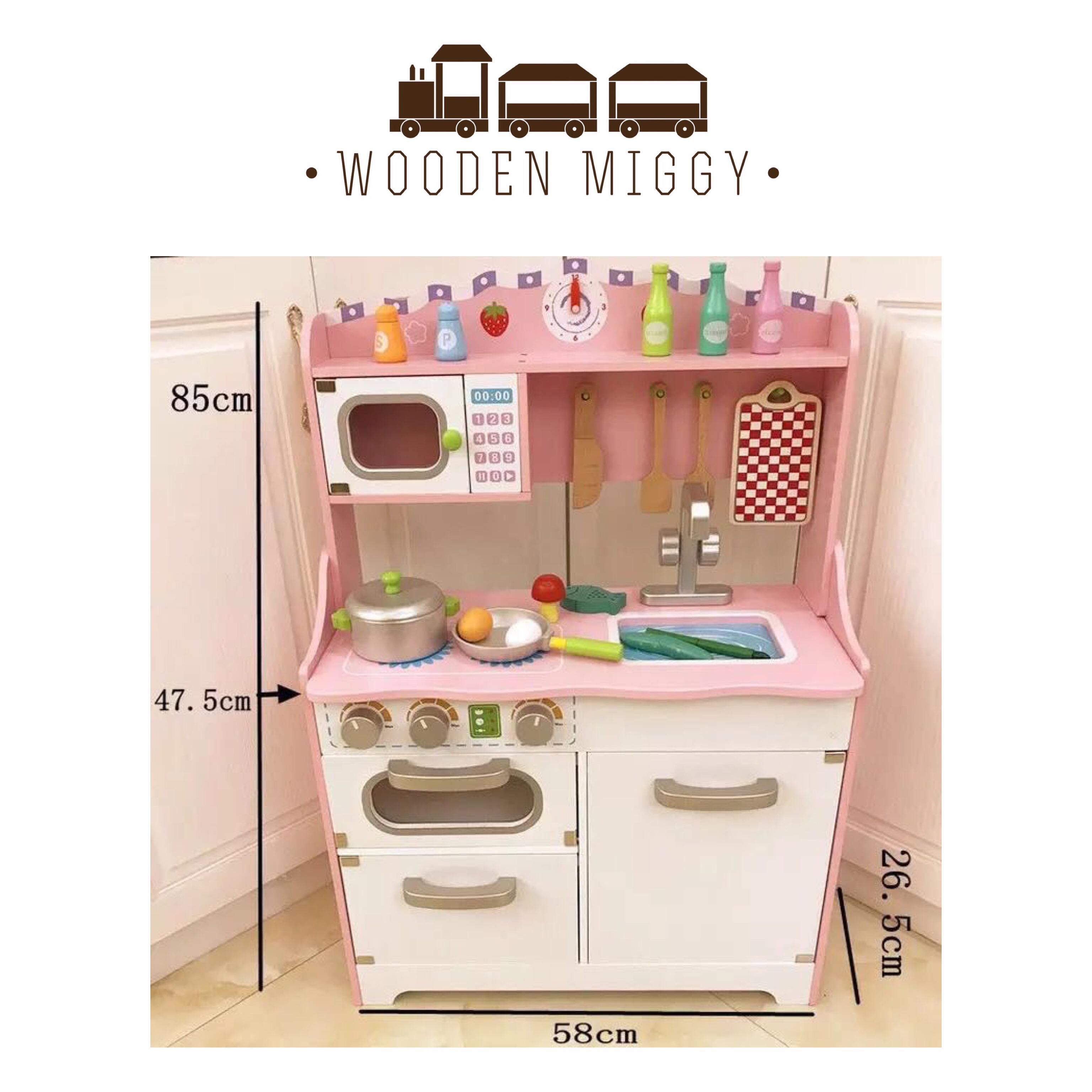 pink wooden toy kitchen