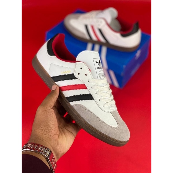 red white and blue adidas sambas