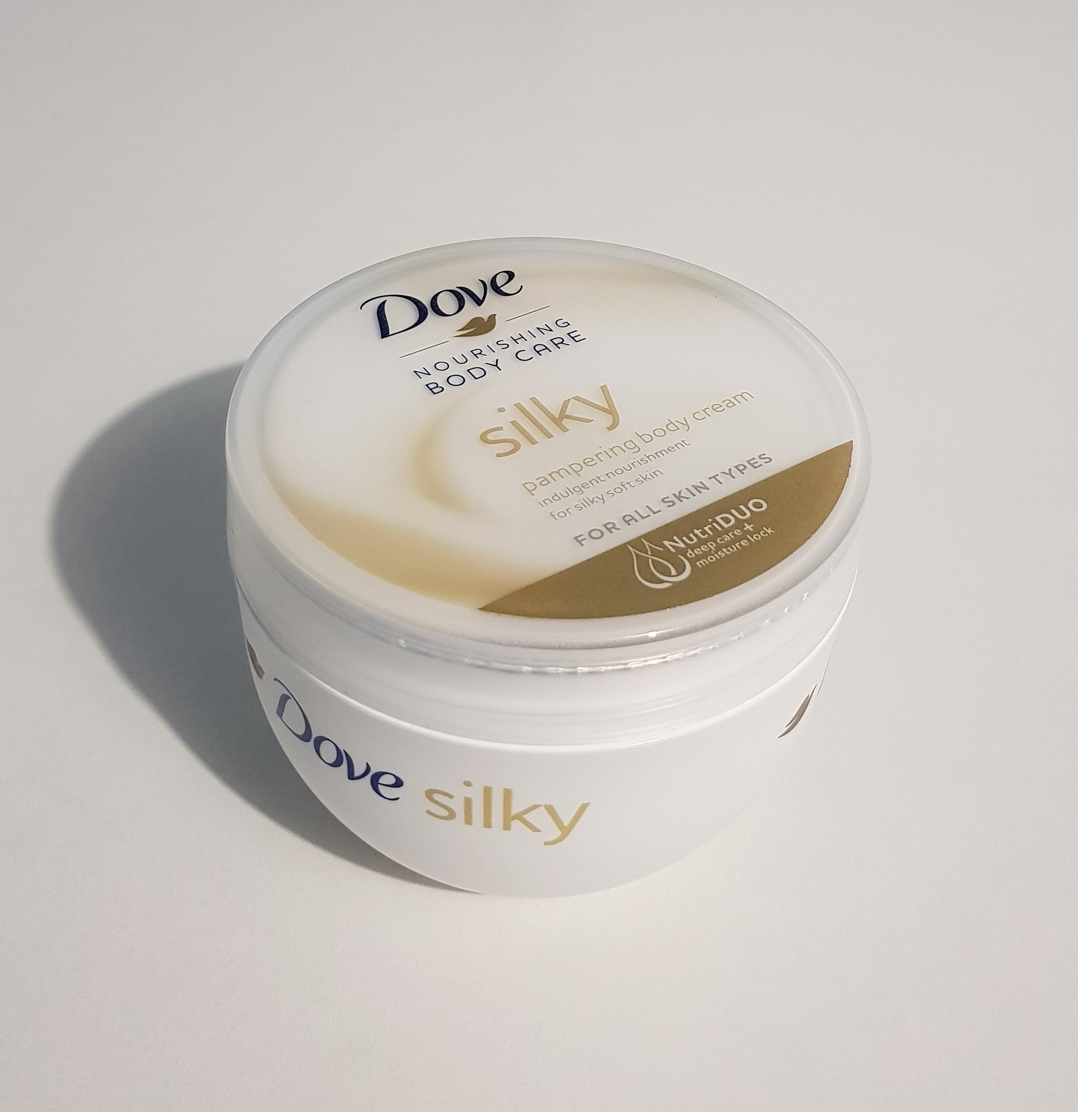 dove nourishing body care silky pampering body cream
