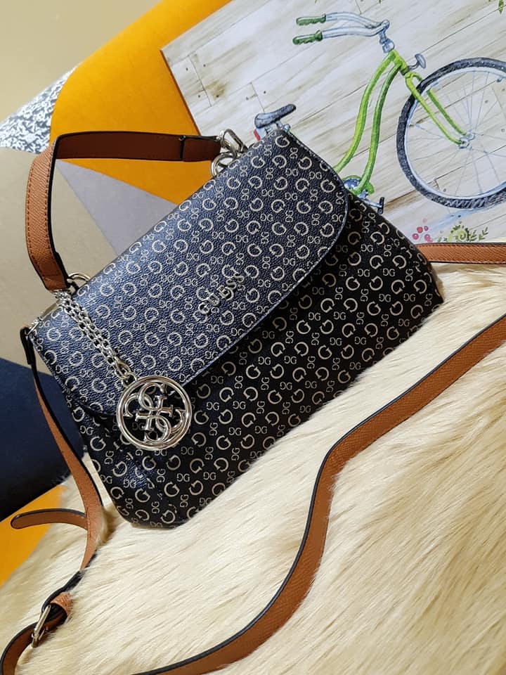 guess hand and sling bag