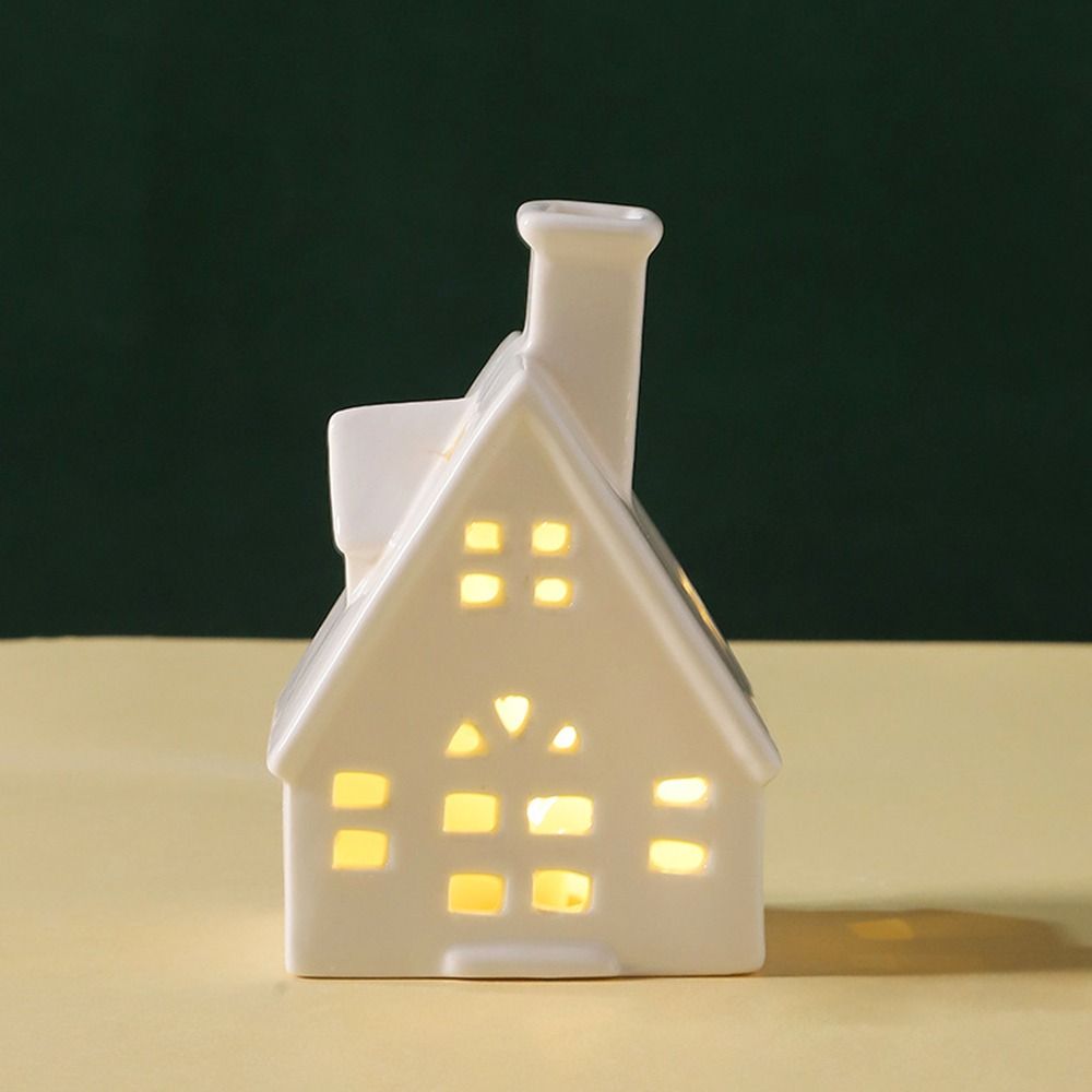 white ceramic lighted houses