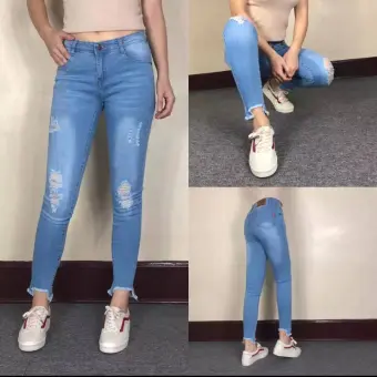 ripped jeans at ankle