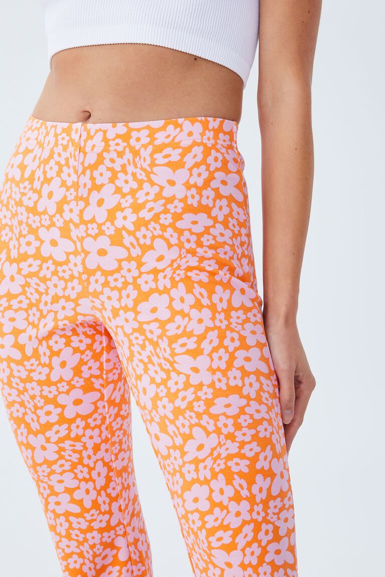 ASOS DESIGN retro floral flare trousers in orange
