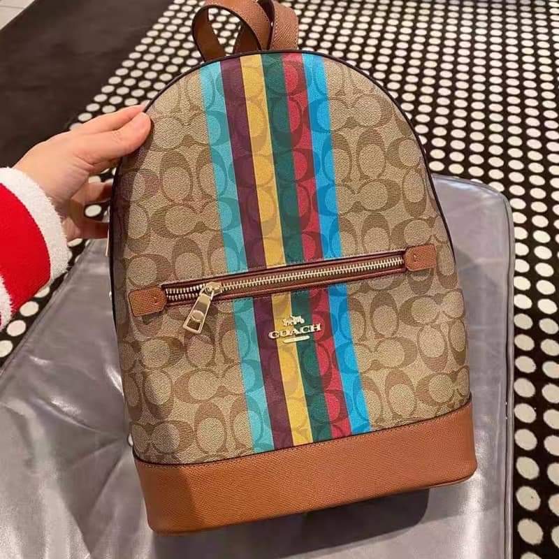 Coach Kenley backpack in offers signature canvas with strips