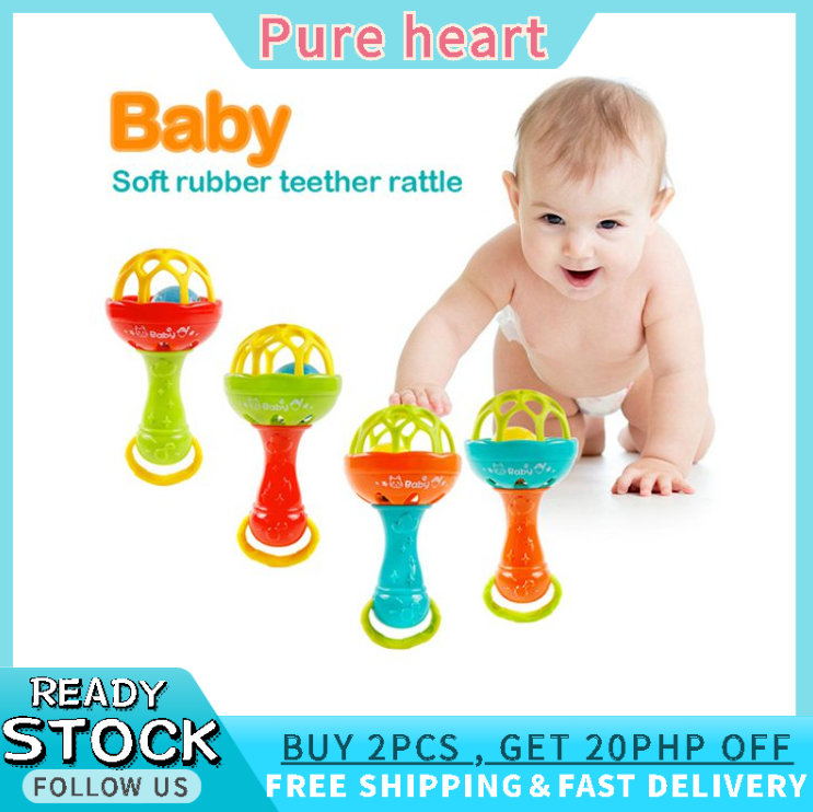 baby holding rattle