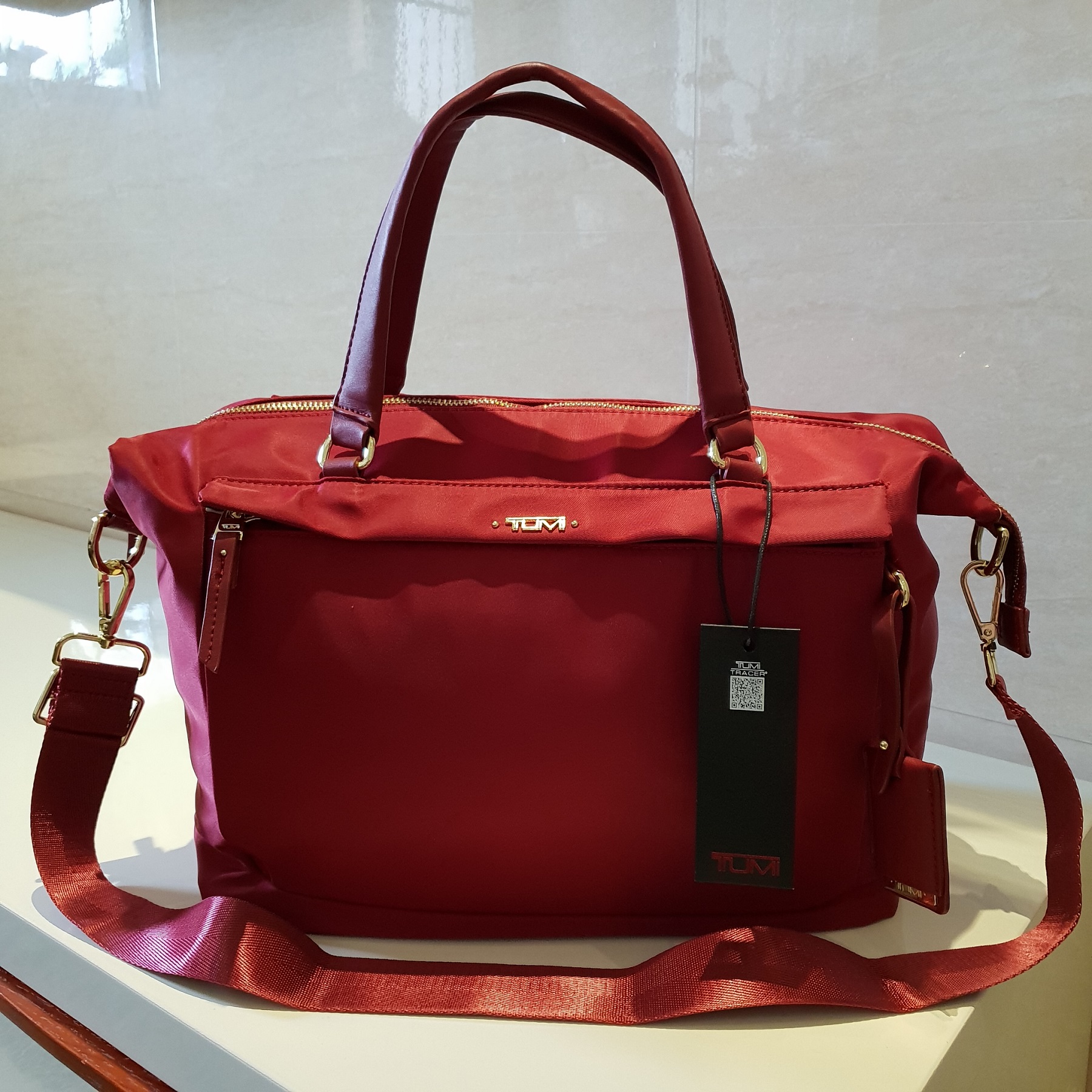 tumi sling bag women