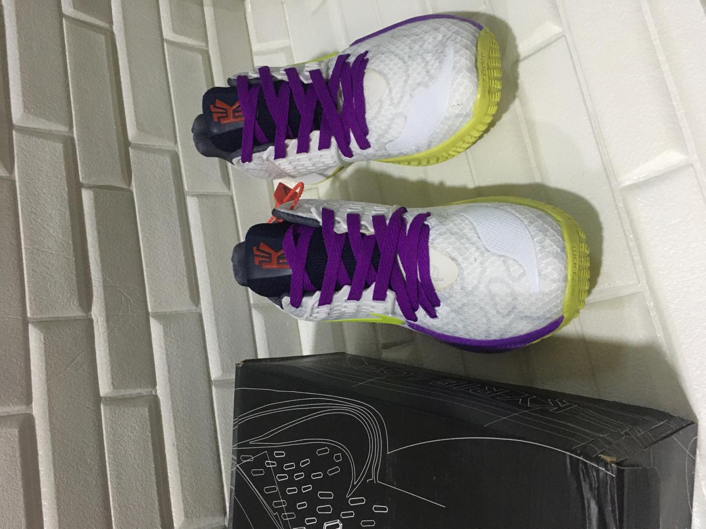 purple and green basketball shoes